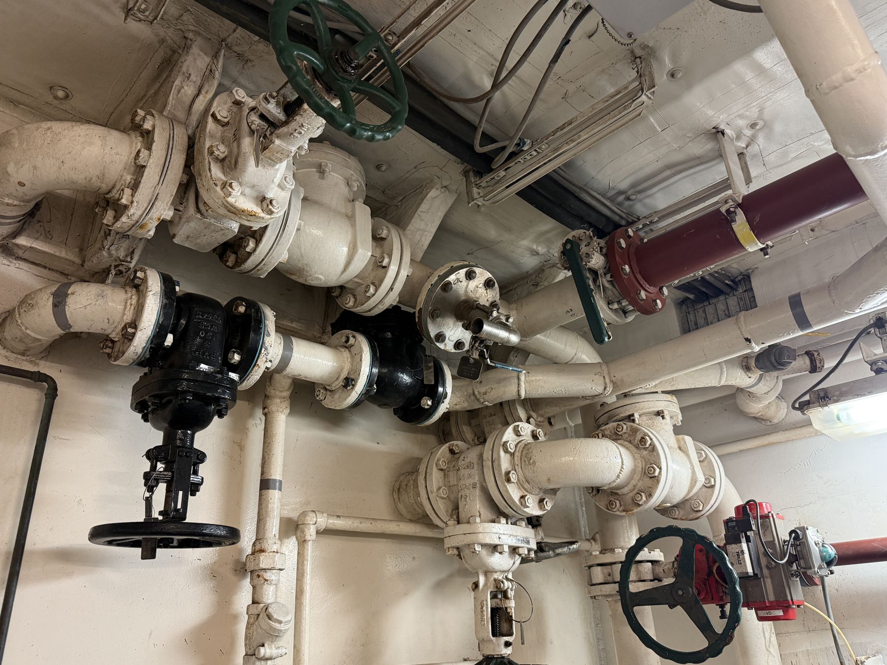 Engine room ballast water piping during a survey