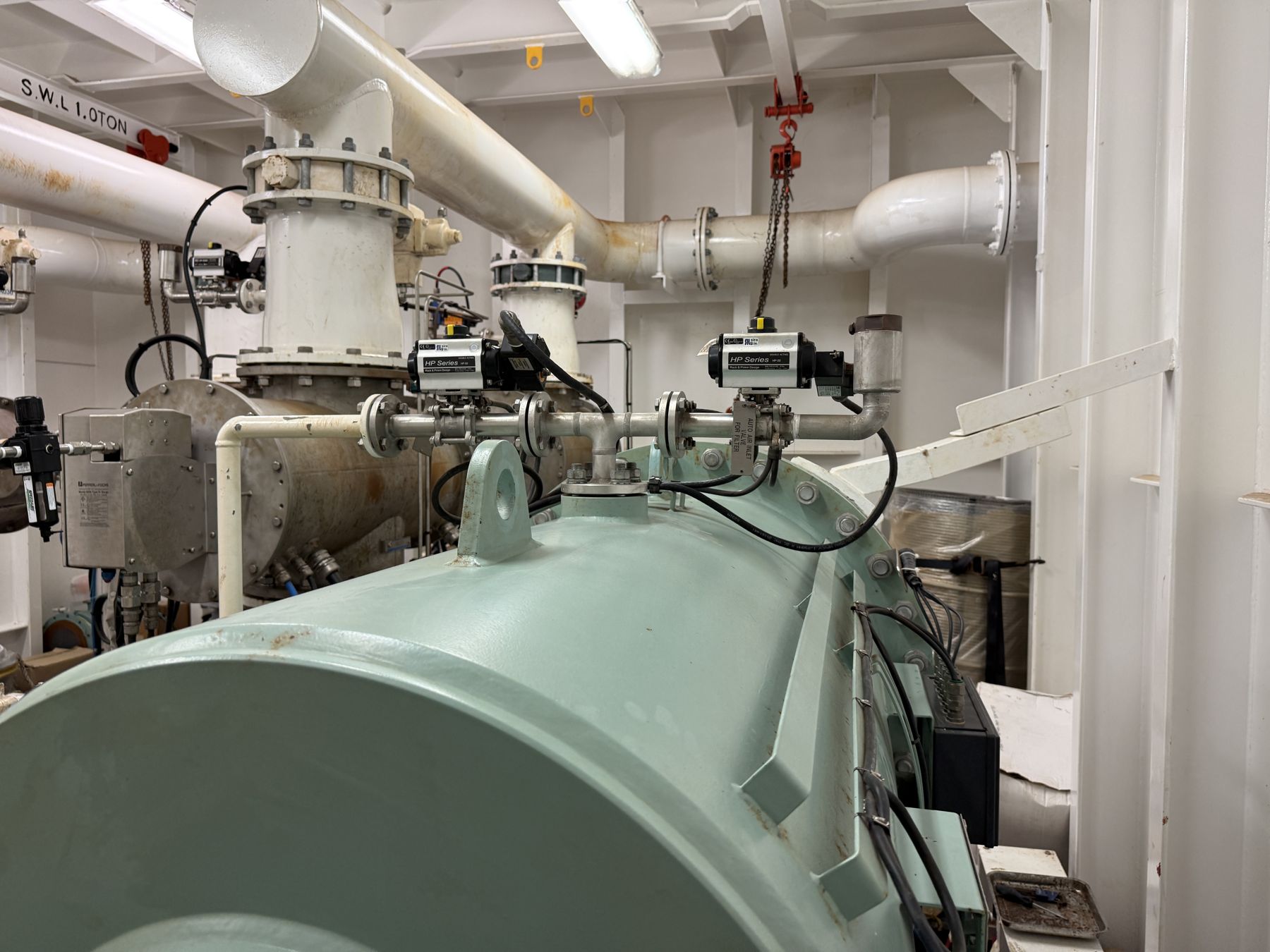 Ballast water treatment machinery aboard a vessel